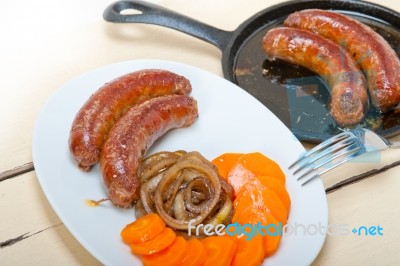 Beef Sausages Cooked On Iron Skillet Stock Photo