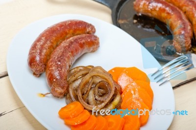 Beef Sausages Cooked On Iron Skillet Stock Photo