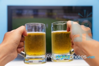 Beer In Front Of The Television Stock Photo