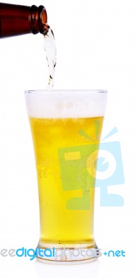 Beer Into Glass Isolated On White Background Stock Photo