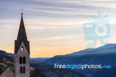 Belfry Of The Parish Church In Villanders At Sunrise Stock Photo