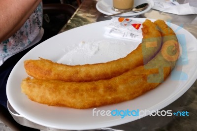 Benalmadena, Andalucia/spain - May 9 : Churros About To Be Eaten… Stock Photo