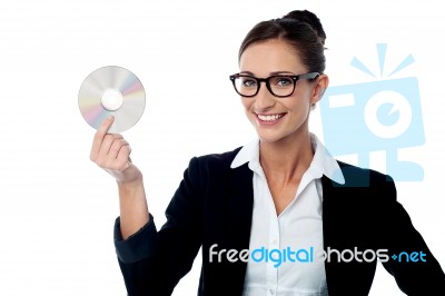 Bespectacled Business Woman Holding Cd Stock Photo