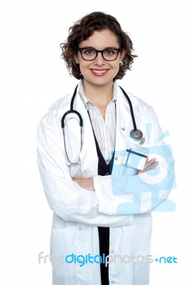 Bespectacled Lady Doctor Posing Confidently Stock Photo