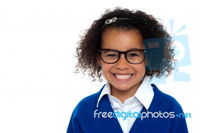 Bespectacled Primary Girl On A White Background Stock Photo