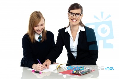 Bespectacled Teacher Pointing Out The Mistakes Stock Photo
