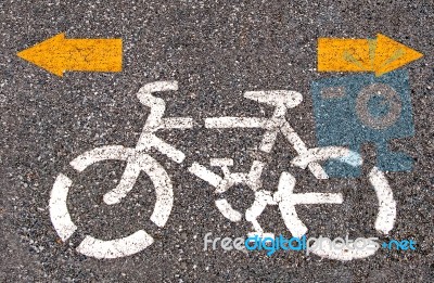 Bicycle Road Sign Painted On The Pavement Stock Photo