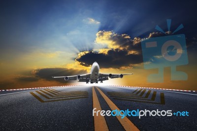 Big Passenger Plane Flying Over Airport Runway Against Beautiful… Stock Photo