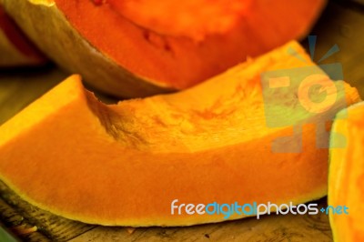 Big Pumpkin Slice On The Market Stand Stock Photo