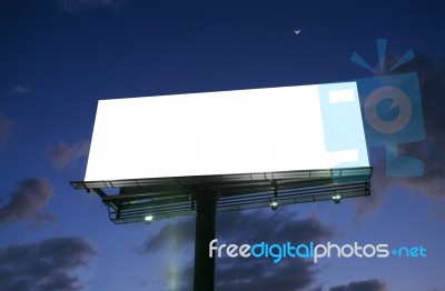 Billboard At Sunset With New Moon Stock Photo
