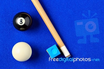 Billiard Balls, Cue And Chalk In A Blue Pool Table Stock Photo