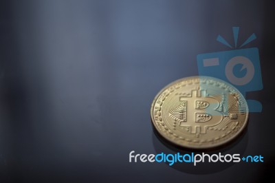 Bitcoin Curency Dof On Blue Light Background Stock Photo