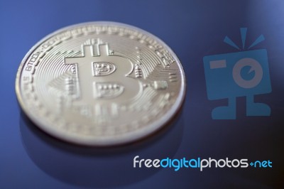 Bitcoin Curency Dof On Blue Light Background Stock Photo