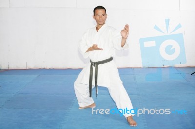 Black Belt Karate Man With Hand In Spade Position Stock Photo