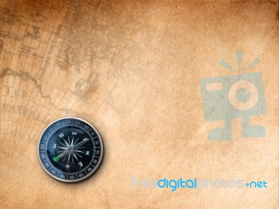 Black Compass On Brown Paper Stock Photo