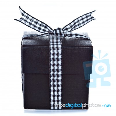 Black Gift Box With Checkered Ribbon Stock Photo