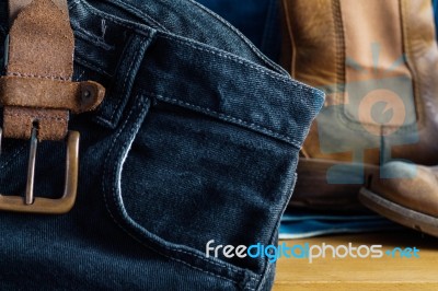 Black Jeans On Table Stock Photo
