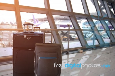 Black Luggage In The Airport Terminal Stock Photo