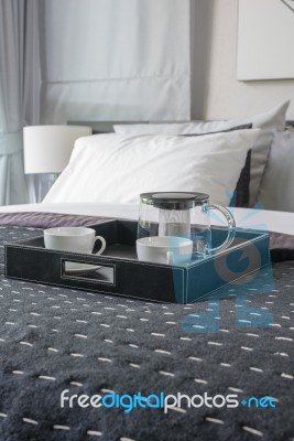 Black Tray Of Coffee Cup On Black Blanket In Modern Bedroom Stock Photo