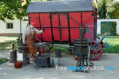 Blacksmith Of Old Reconstruction At Wilanow Palace In Warsaw Stock Photo