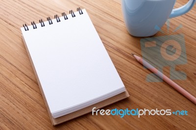 Blank Notebook On Wood Table Stock Photo