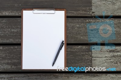 Blank White Paper Sheet On Clipboard And Black Pen Stock Photo