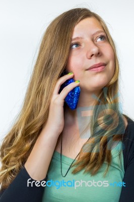 Blonde Teenage Girl Phoning Mobile Stock Photo