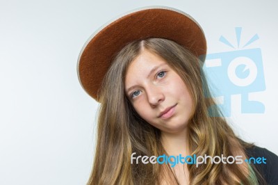 Blonde Teenage Girl Wearing Brown Hat Stock Photo