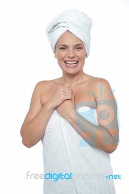 Blonde Woman In Towel Smiling Heartily Stock Photo