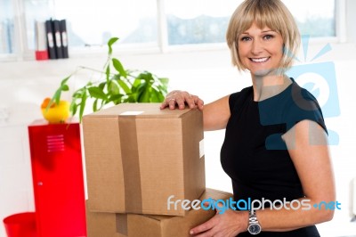 Blonde Woman Is Ready To Unpack Her Office Stuff Stock Photo