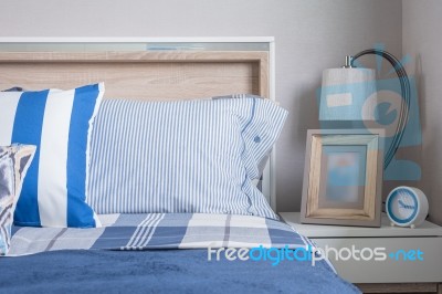Blue Color Tone Of Kid's Bedroom With Alarm Clock And Lamp Stock Photo