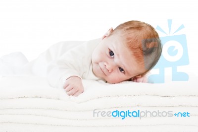 Blue Eyes Baby Boy On White Towels Stock Photo