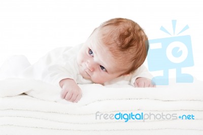 Blue Eyes Baby Boy On White Towels Stock Photo