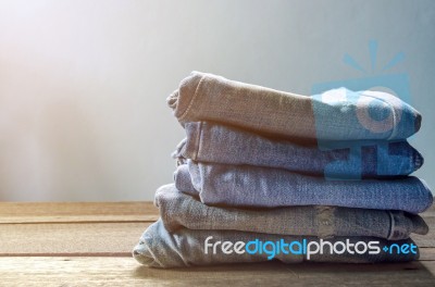 Blue Jean And Jean Lack Texture On The Wooden Floor Stock Photo