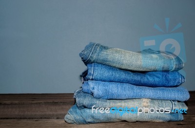 Blue Jean And Jean Lack Texture On The Wooden Floor Stock Photo