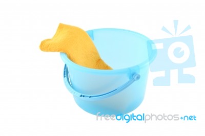 Blue Plastic Bucket And Left Yellow Cloth Clean On White Background Stock Photo