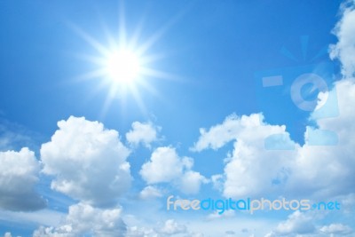 Blue Sky With Clouds And Sun Stock Photo