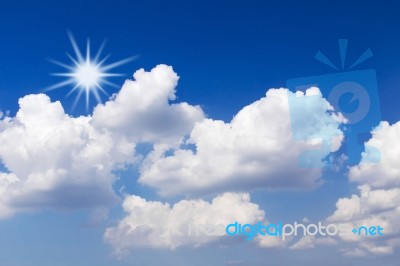 Blue Sky With White Clouds And Sun Stock Photo