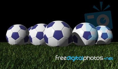 Blue Soccer Balls On A Green Grass Stock Image