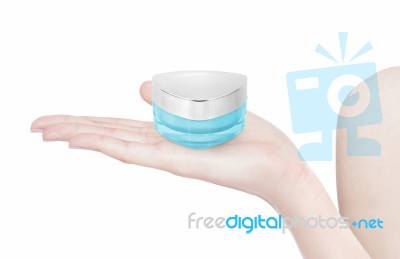 Blue Triangle Cosmetic Jar On Hand Isolated Stock Photo