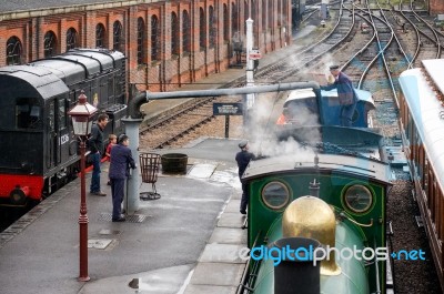 Bluebell Steam Engine Taking On Water At Sheffield Park Station Stock Photo