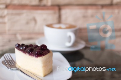 Blueberry Cheesecake And Hot Coffee Stock Photo