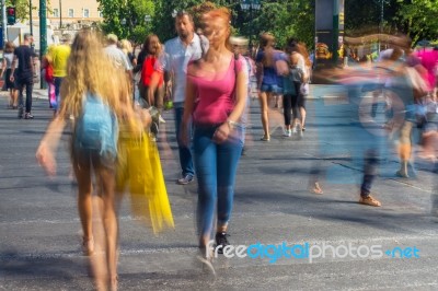 Blurry People Walking In The Street Stock Photo