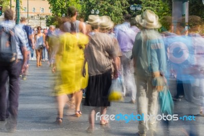 Blurry People Walking In The Street Stock Photo