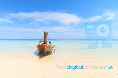 Boat On The Beach With Blue Sky Stock Photo