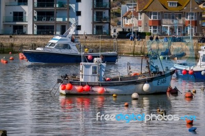 Boats In The Harbour At Lyme Regis Stock Photo