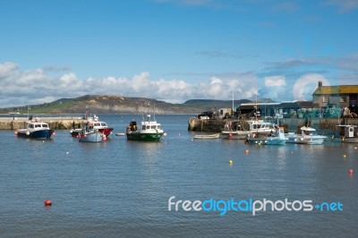 Boats In The Harbour At Lyme Regis Stock Photo