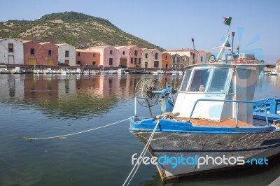 Boats Of Fishermen On The Temo River And Typical Colored Facade Of Bosa, Oristano Province, Sardinia, Italy Stock Photo