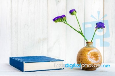 Books Or Journal With Flowers Arranged On A Neutral White Painted Desk Stock Photo