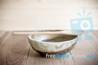 Bowl On Wooden Table Over Grunge Background Stock Photo